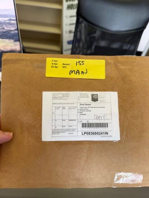 Plain exterior modafinil shipping package on delivery, photographed by BuyModa.net April 2026